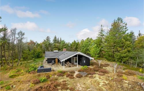 a house in the middle of a field at Awesome Home In Skagen With Wifi in Skagen