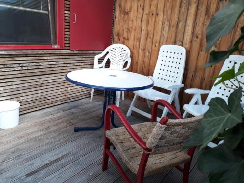 a table and chairs sitting on a porch at Ferienhaus am Eichert in Furth im Wald