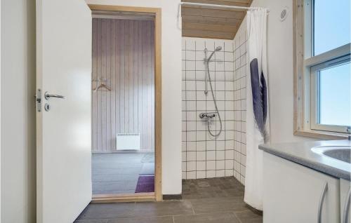 a bathroom with a shower and a sink at Lovely Home In Bindslev With Sauna in Bindslev