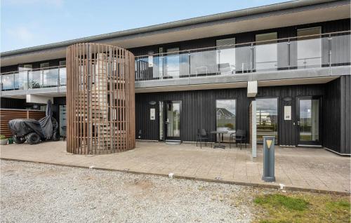 a large building with a patio in front of it at One-Bedroom Apartment In Romo in Havneby