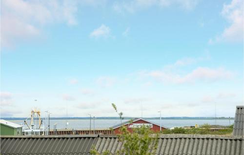 a view of the ocean from a fence at One-Bedroom Apartment In Romo in Havneby