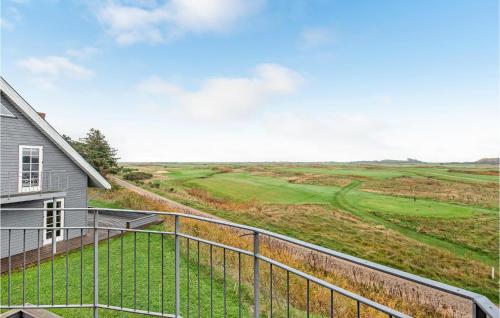 a view of a golf course from a house at Holiday Home Vestergade Rømø in Rømø Kirkeby
