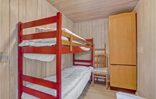a room with two bunk beds in a cabin at Holiday Home Østkrogen Blåvand X in Blåvand