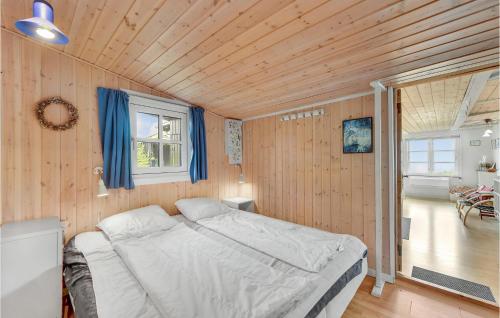 A bed or beds in a room at 2 Bedroom Cozy Home In Esbjerg V