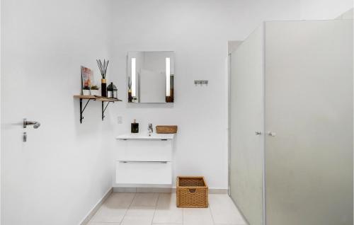 a bathroom with white walls and a glass shower at Amazing Home In Grindsted With Sauna in Grindsted