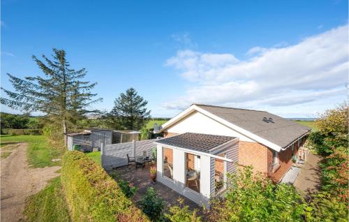 an aerial view of a small house in a field at Cozy Home In Vinderup With Wifi in Vinderup