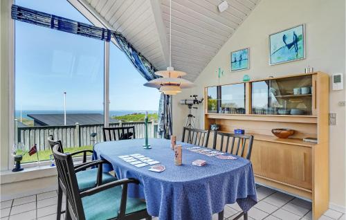 a kitchen and dining room with a table and chairs at Stunning Home In Struer With Wifi in Struer