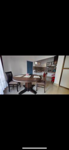 a dining room with a table and two chairs at Mango Villa in Guwahati