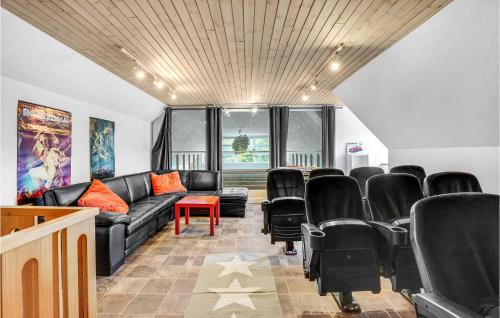 a waiting room with a couch and chairs at Nice Home In Sjlund With Kitchen in Sønder Bjert