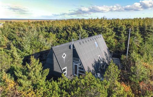 an overhead view of a house in the middle of a forest at Two-Bedroom Holiday Home In Ulfborg in Fjand Gårde
