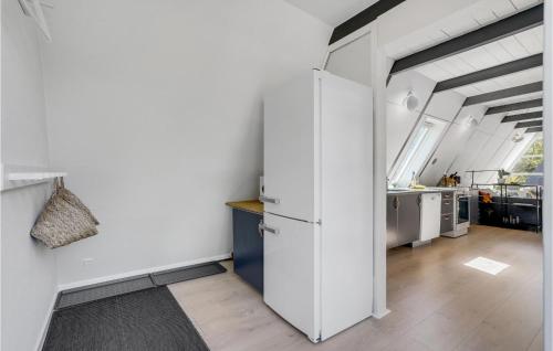 a kitchen with a white refrigerator in a room at Two-Bedroom Holiday Home In Ulfborg in Fjand Gårde