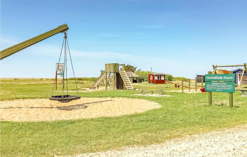 a park with a playground with a swing at Two-Bedroom Holiday Home In Ulfborg in Fjand Gårde