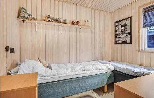 a room with a large bed in the corner at Amazing Home In Grenaa With Kitchen in Grenå