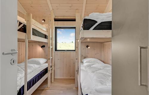 a room with bunk beds in a tiny house at Cozy Home In Ejstrupholm in Ejstrup