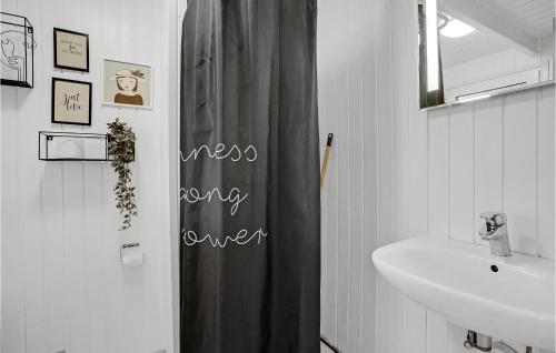 a bathroom with a black shower curtain and a sink at Nice Home In Sydals With Wifi in Høruphav