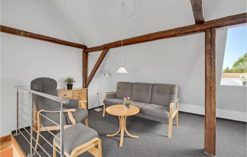 a waiting room with two chairs and a table at Holiday Home Grønmark in Høruphav