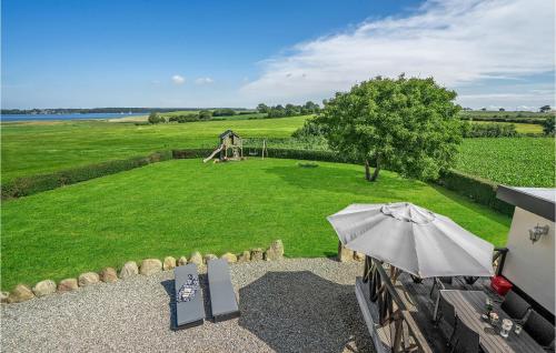 an overhead view of a park with a playground and an umbrella at Holiday Home Grønmark in Høruphav