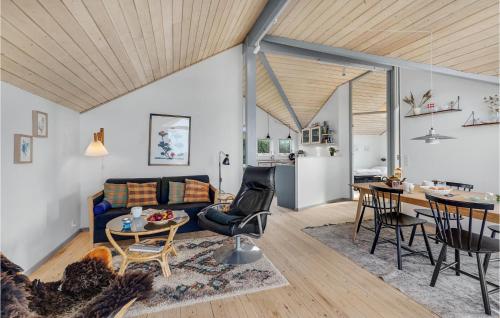 a living room with a couch and a table at Three-Bedroom Holiday Home In Slagelse in Slagelse