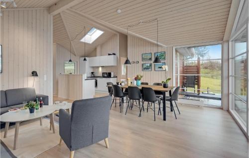 a dining room and kitchen with a table and chairs at Nice Home In Slagelse With Wifi in Slagelse