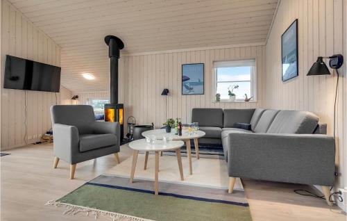 a living room with a couch and chairs and a table at Nice Home In Slagelse With Wifi in Slagelse