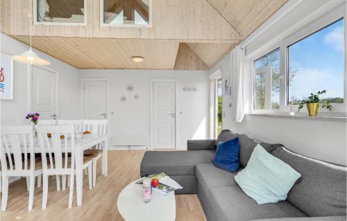 a living room with a couch and a table at Lovely Home In Tranekær With Wifi in Tranekær
