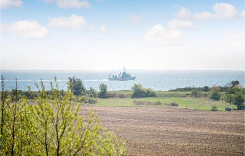 a large ship in the water in a field at Holiday Home Sønderskovvej in Illebølle