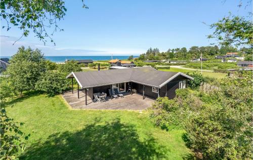 an overhead view of a black house with a deck at Holiday Home Nordvangsvej With Fireplace And Shower in Allingåbro
