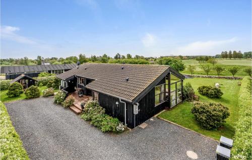 an overhead view of a black house with a garden at Holiday Home Smørblomstvænget Humble X in Humble