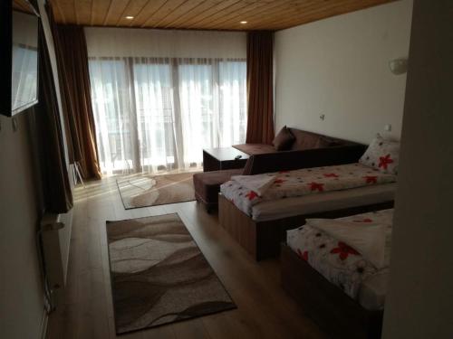 TV a/nebo společenská místnost v ubytování Къща Генчеви