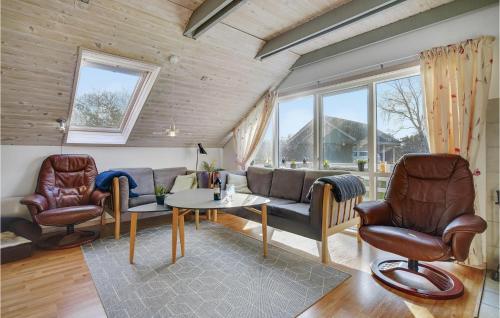 a living room with a couch and chairs and a table at Three-Bedroom Holiday Home In Dannemare in Dannemare