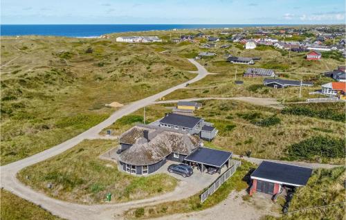 an aerial view of a house on a hill next to the ocean at Nice Home In Vejers Strand With Wifi in Vejers Strand