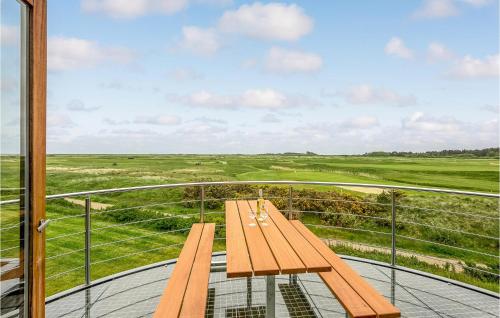 a wooden bench sitting on top of a balcony at Holiday Home Vestergade Iv in Rømø Kirkeby