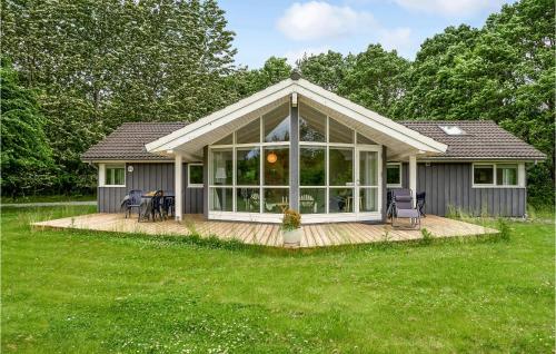 a small house with a deck at Holiday Home Vemb With Fireplace 07 in Vemb