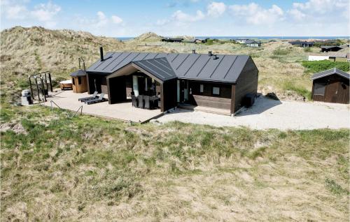 an overhead view of a house in a field at Studio Holiday Home In Lokken in Løkken