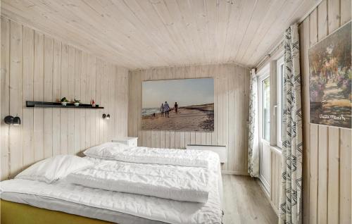 a bedroom with two beds and a view of the beach at 3 Bedroom Nice Home In Thisted in Nørre Vorupør