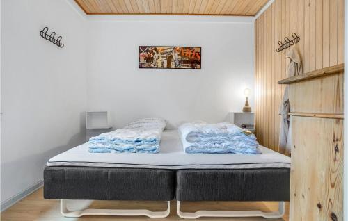 a bed with two pillows on it in a room at 4 Bedroom Lovely Home In Knebel in Knebel