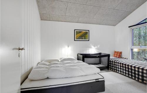 a large white bed in a room with a window at Pet Friendly Home In Gistrup With Wifi in Gistrup