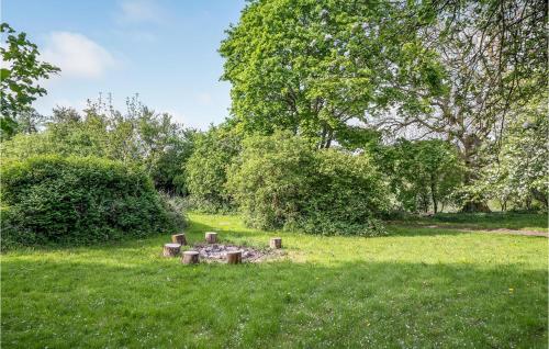 a fire pit in the grass in a park at Beautiful Home In Sønder Stenderup in Sønder Stenderup