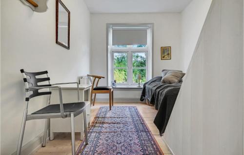 a room with a bed and a desk and a window at 6 Bedroom Gorgeous Home In Kværndrup in Kværndrup