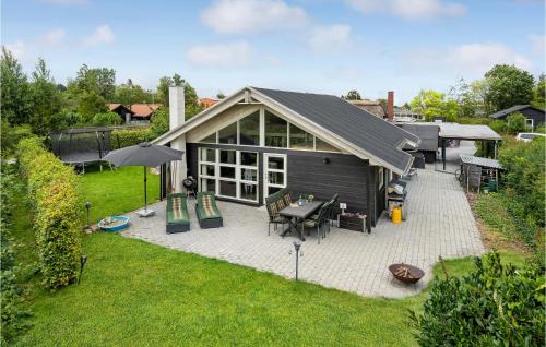 an overhead view of a house with a patio at Beautiful Home In Børkop With Kitchen in Børkop