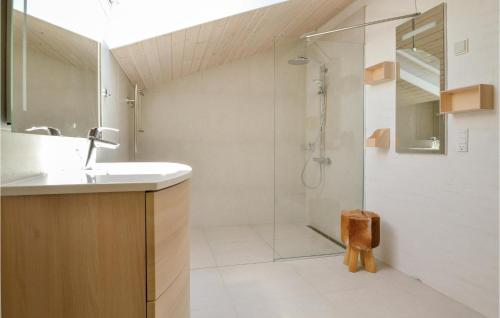 a bathroom with a sink and a shower at Holiday Home Lyngvej Fanø X in Fanø