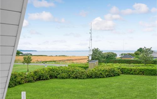 a view from the porch of a house with a grass yard at Gorgeous Home In Brenderup Fyn in Bro