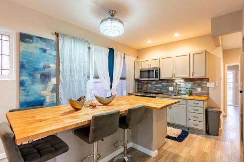 a kitchen with a wooden counter top in a room at Pretty Blue Bungalow in Carondelet