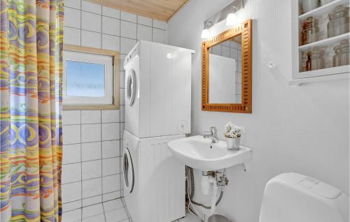 a white bathroom with a sink and a refrigerator at Gorgeous Home In Hejls With Kitchen in Hejls