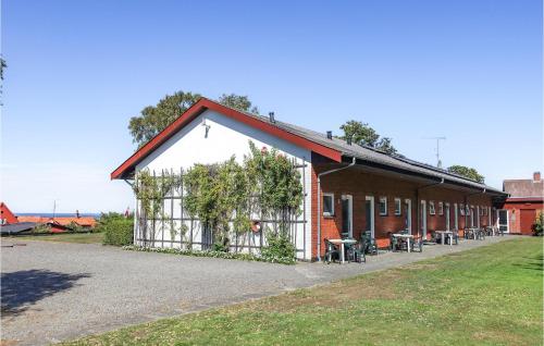 a building with vines on the side of it at Awesome Apartment In Allinge in Allinge