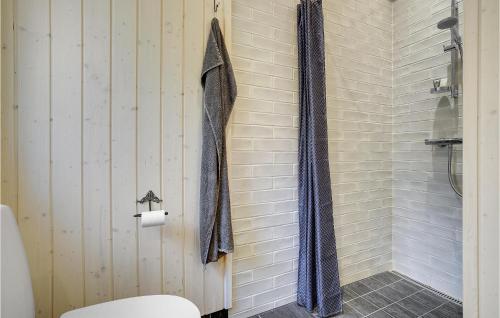 a bathroom with a shower and a toilet in it at Beach Front Home In Stege With Wifi in Stege
