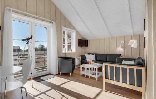 a living room with a couch and a table at 3 Bedroom Lovely Home In Rømø in Havneby