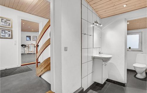 a bathroom with a toilet and a sink at 2 Bedroom Stunning Apartment In Billund in Billund