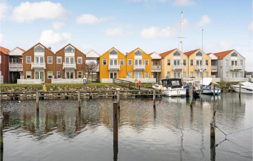 a group of houses and boats in a marina at Stunning Apartment In Rudkøbing in Rudkøbing