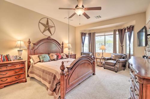 a bedroom with a large bed and a ceiling fan at Phoenix Home with Private Pool about 8 Mi to Dtwn in Phoenix